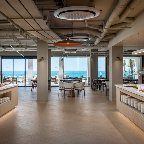 a buffet area in a restaurant with the letters al on the wall