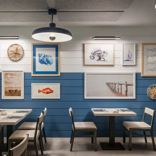 ESTIVAL: Corporativa decor features nautical art.