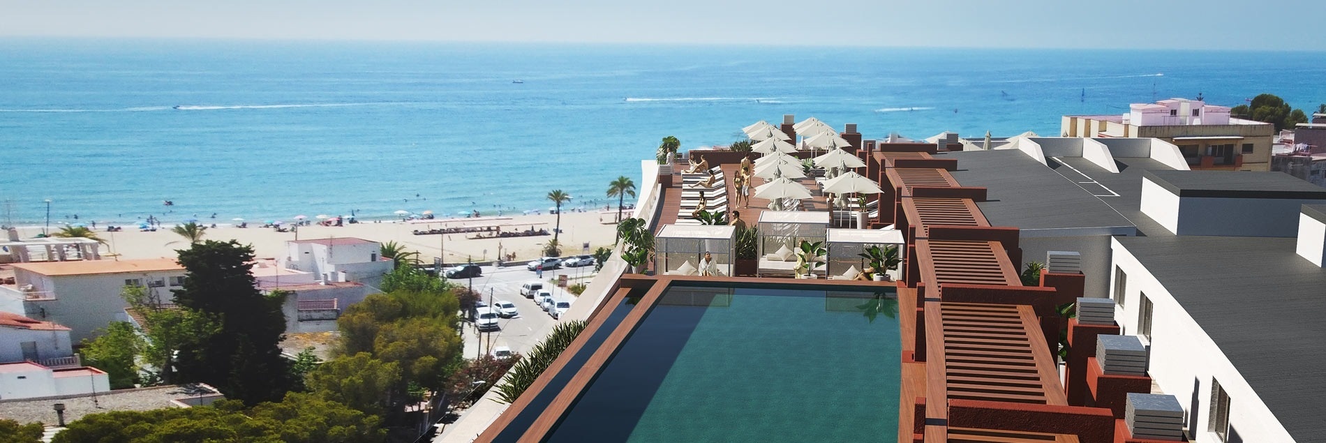 une vue aérienne d' une piscine sur le toit d' un bâtiment avec l' océan en arrière-plan