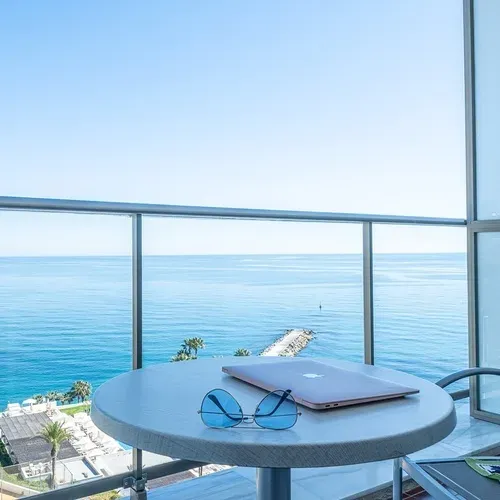 Estival Torrequebrada Benalmádena: Balcony view with laptop & sunglasses. Book your stay!