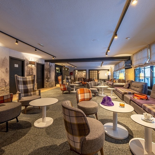 a large room with a lot of chairs and tables