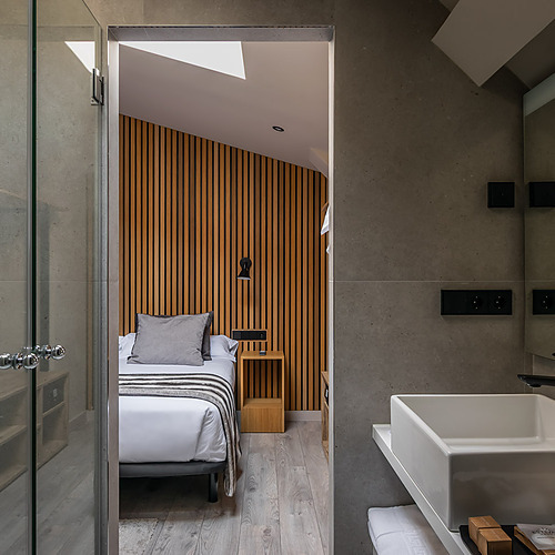 Twin room with fur throws and mountain mural, perfect for ESTIVAL: Corporate.
