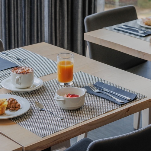 a table with a menu on it that says ' hotel ' on it