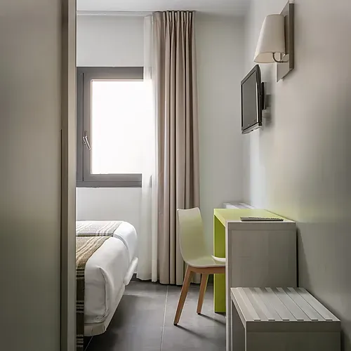 Hotel Cristina | Andorra | Estival Group | Cozy twin beds with plaid throws. Perfect stay.