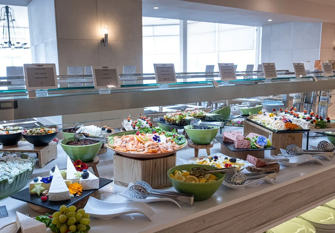 ESTIVAL Corporate Buffet: Featuring seafood, cheeses, and salads.