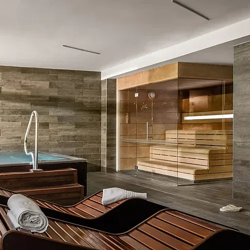 Relax at ESTIVAL: Corporativa, modern spa with pool and sauna.