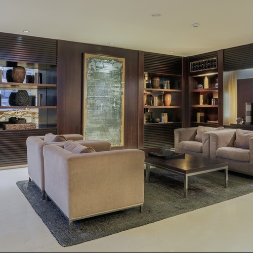 a living room with two chairs and a coffee table