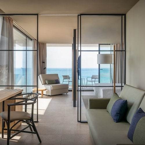 a hotel room with a view of the ocean