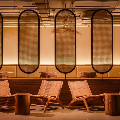 a row of chairs and tables in a room