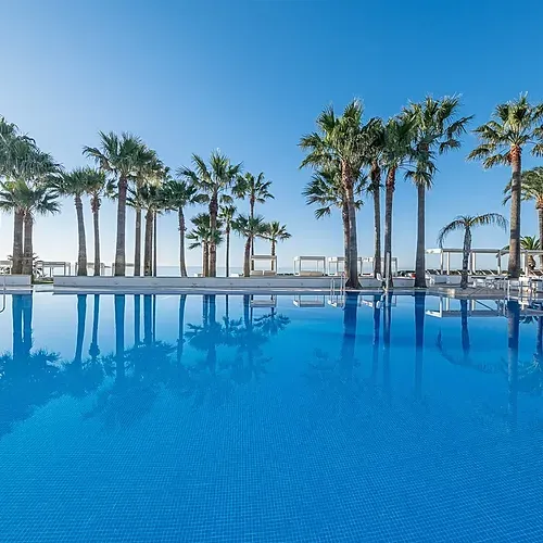 Estival Torrequebrada Benalmádena: Poolside palm trees & ocean views. Book your stay!