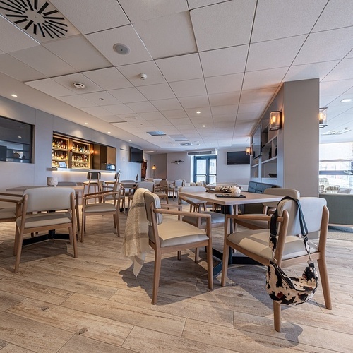 a restaurant with tables and chairs and a bar