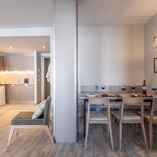 a bottle of wine sits on a table in a kitchen