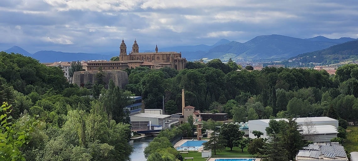 a view of a city with mountains in the background
