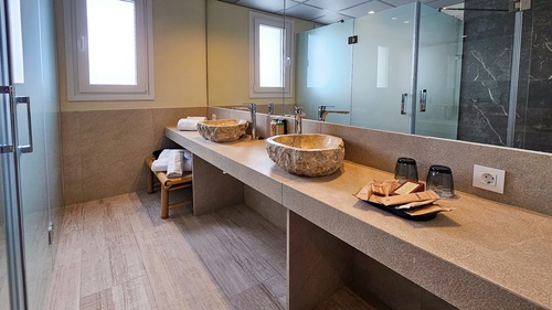 a bathroom with two sinks and a mirror