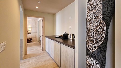 a nespresso machine sits on a counter in a hallway