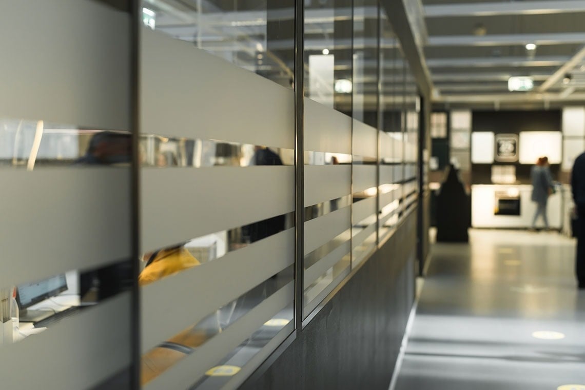 Modern office with glass partitions. Ideal for putting your feet up: Corporate.