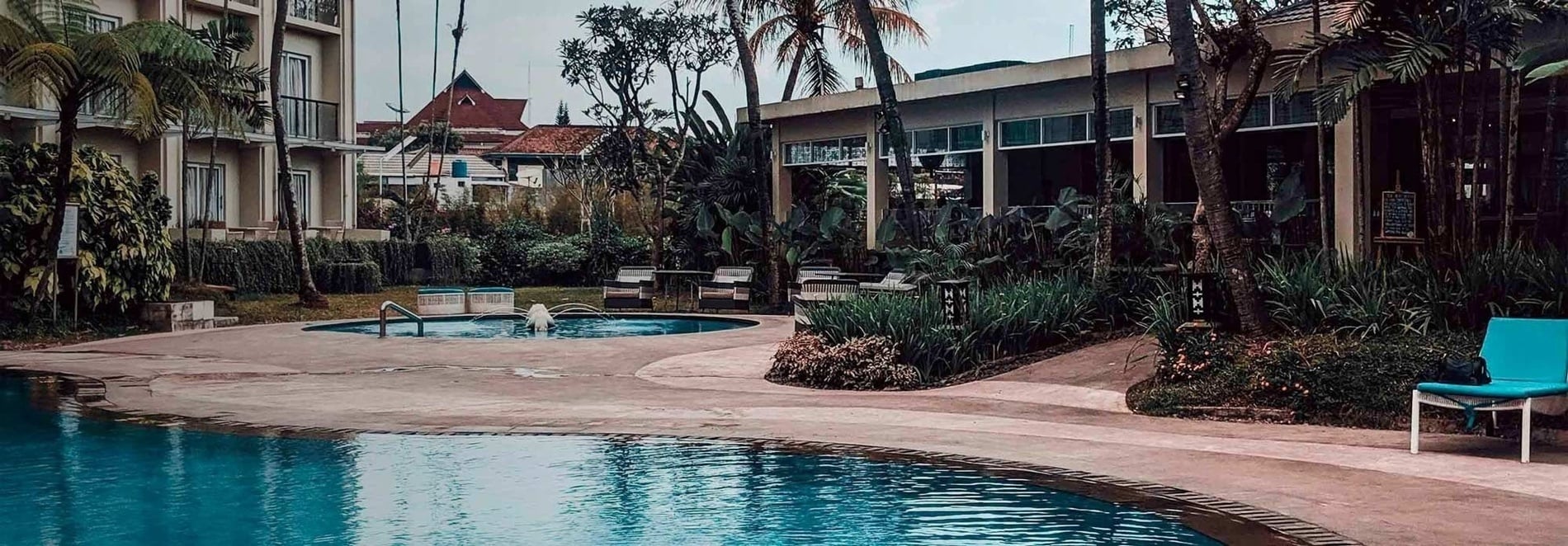 Relax by the pool and garden, feet up: a corporate oasis.
