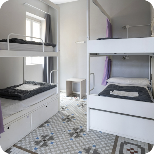 Shared dormitory with bunk beds. Put your feet up: corporate style!
