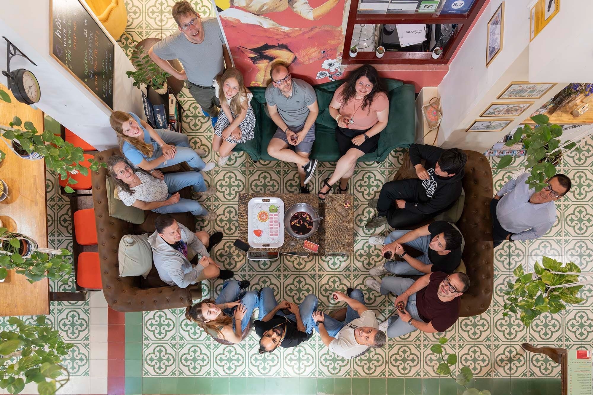 Relaxed group at a boutique hotel, feet up, perfect for corporate retreats.