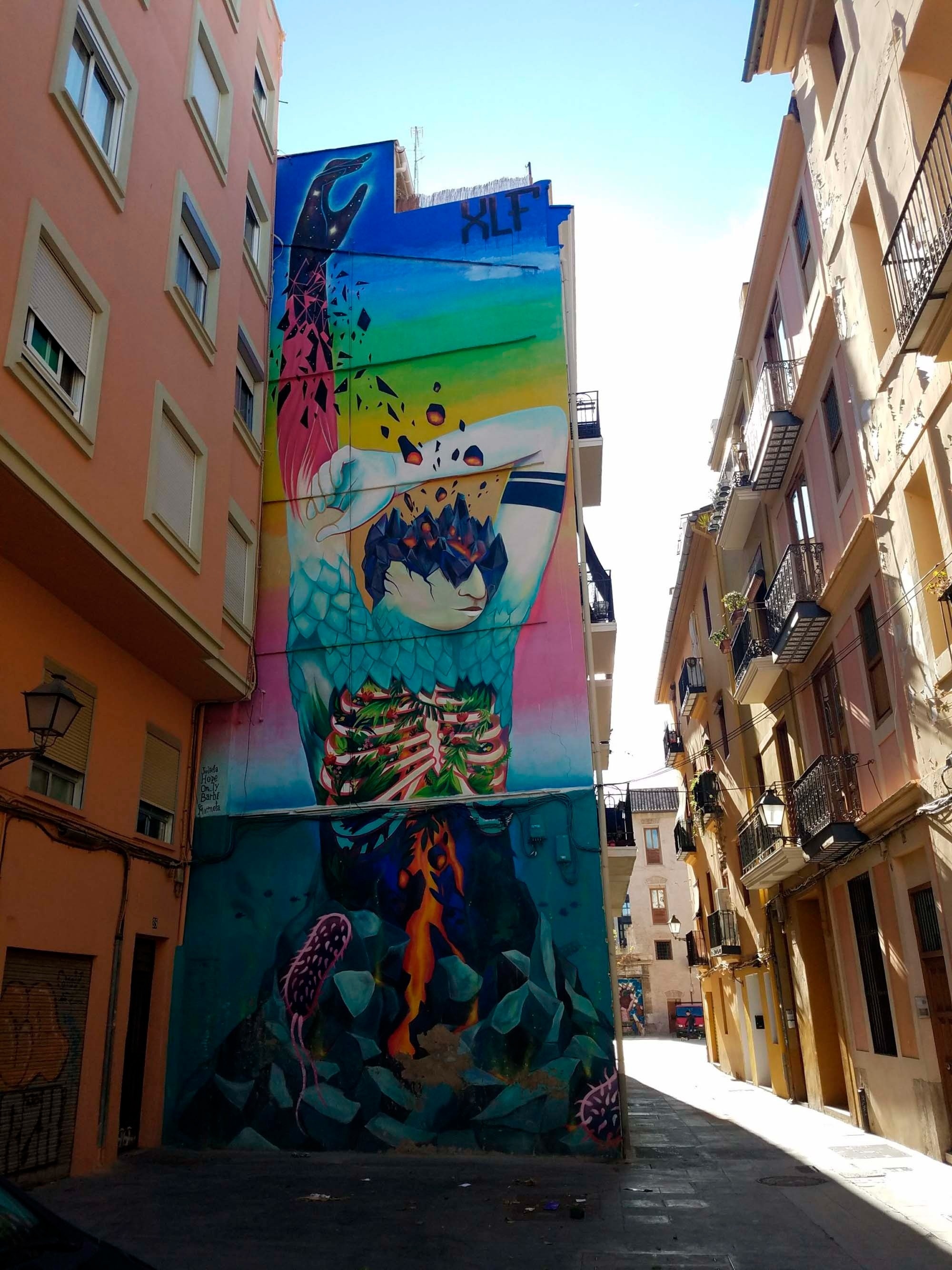 Historic building with mural in Valencia. Feet up: Corporate stay!