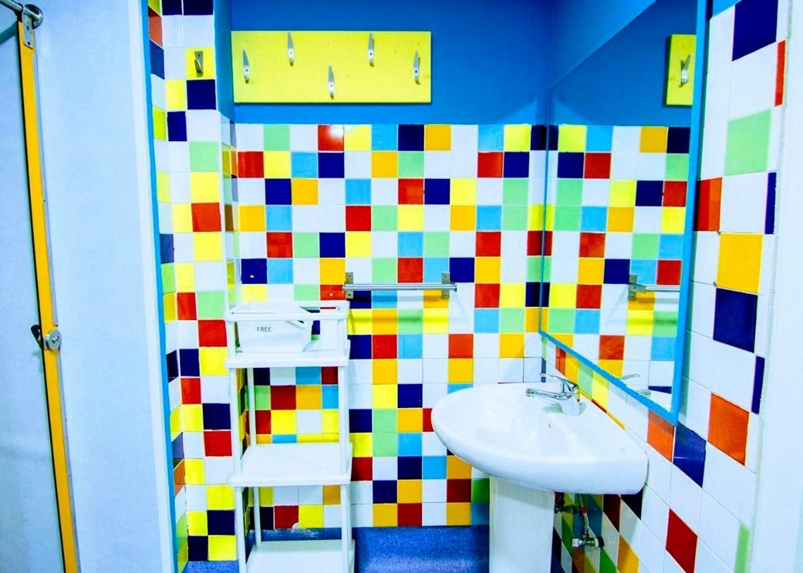 Colorful tiled bathroom. Relax and feel corporate with your feet up!