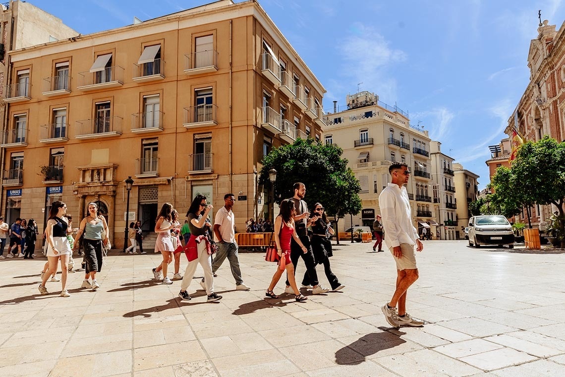Relax in Alicante: Feet up, corporate stay in sunny plaza.