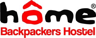 Logo "home Backpackers Hostel". Put your feet up: Stylish hostel.