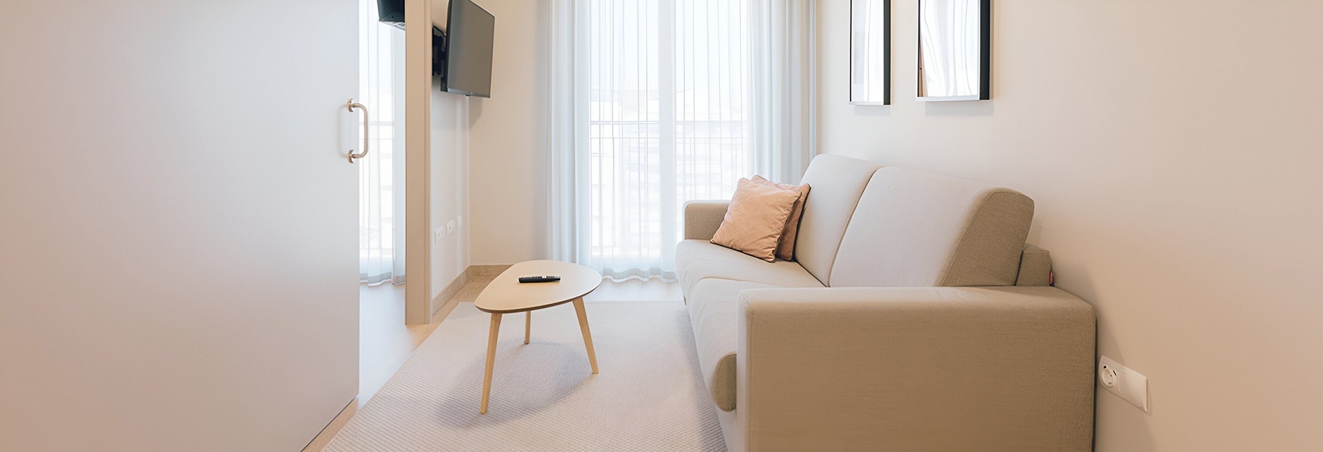 a living room with a couch and a television