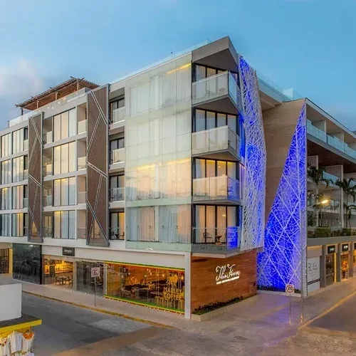 Modern The Fives Corpo building with balconies and blue lights.