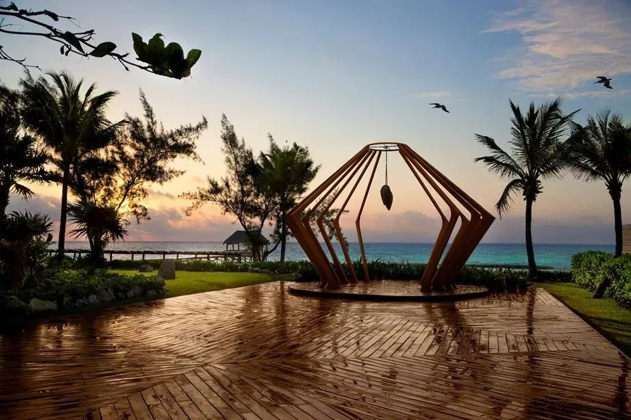 The Fives Cayo, wooden structures on the beach at sunset
