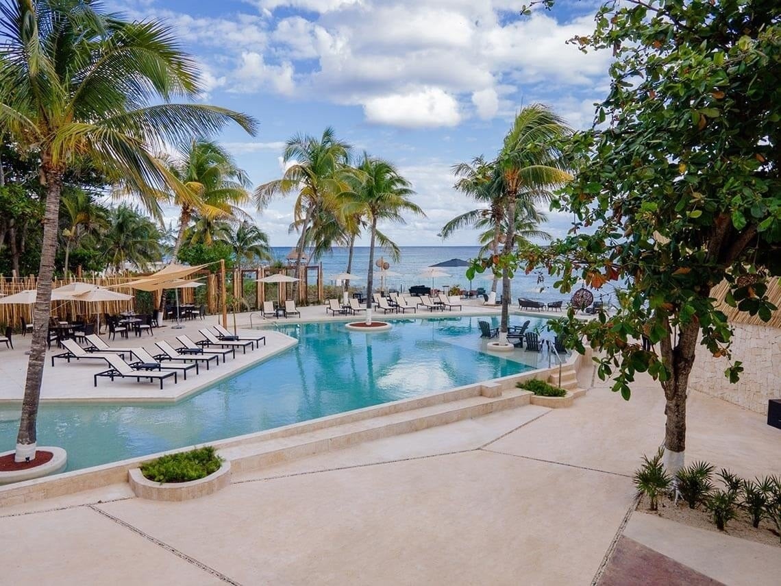 Beachfront pool at The Beachfront by The Fives, adults-only all-inclusive resort.