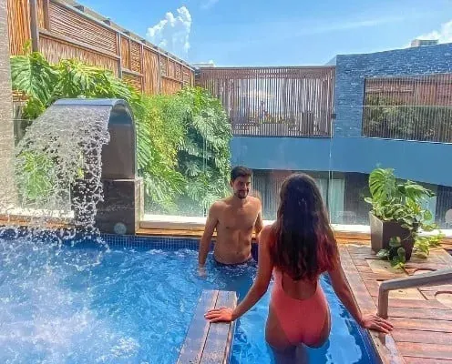 Couple enjoying private pool at The Fives Corpo, Riviera Maya.