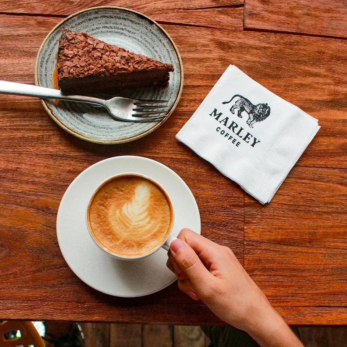 Enjoy a slice of chocolate cake and coffee at The Fives Downtown Hotel.