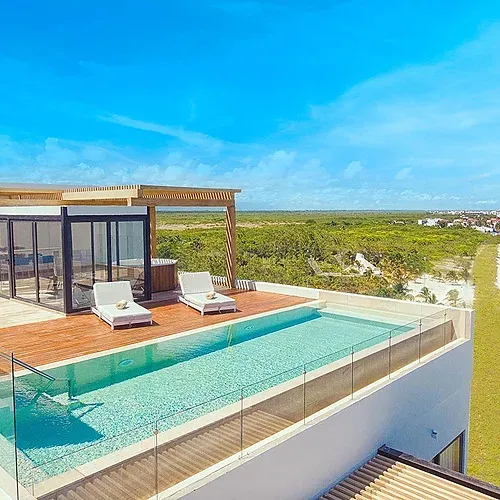 The Fives Corpo: Rooftop infinity pool overlooking the Caribbean Sea.