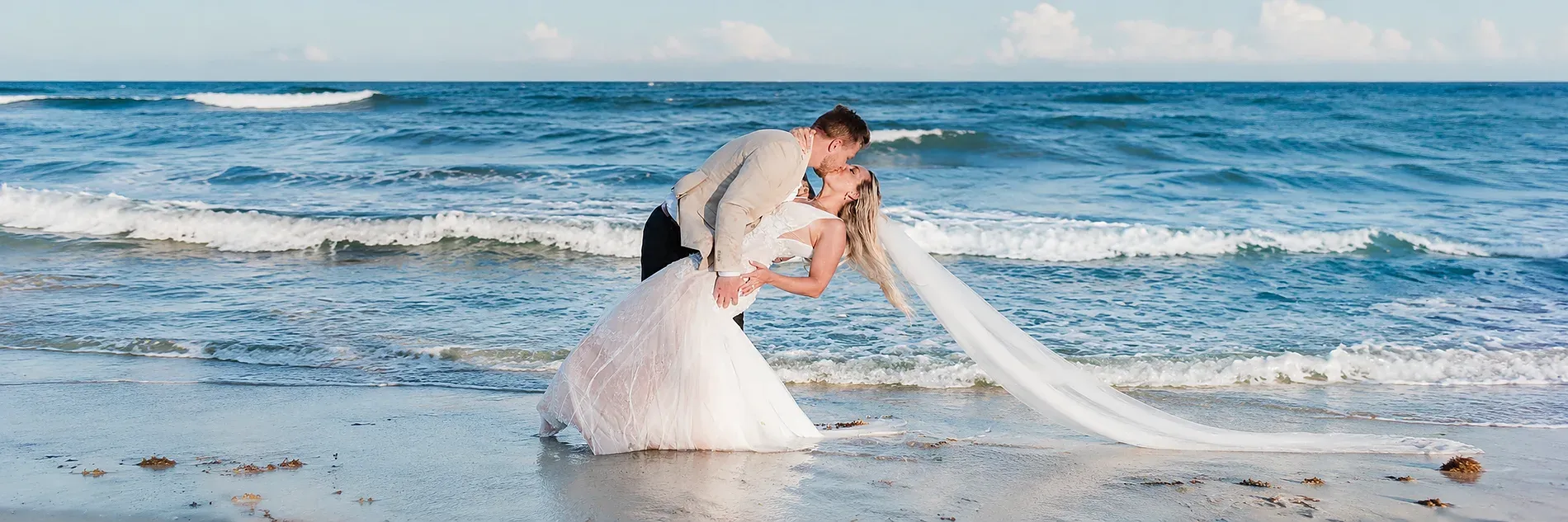 Romantic wedding dip with petals falling. Enjoy a Free Wedding Ceremony at The Fives Hotels.