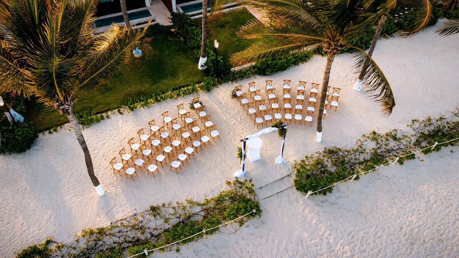 Intimate beach wedding setup at The Fives Hotels in the Riviera Maya