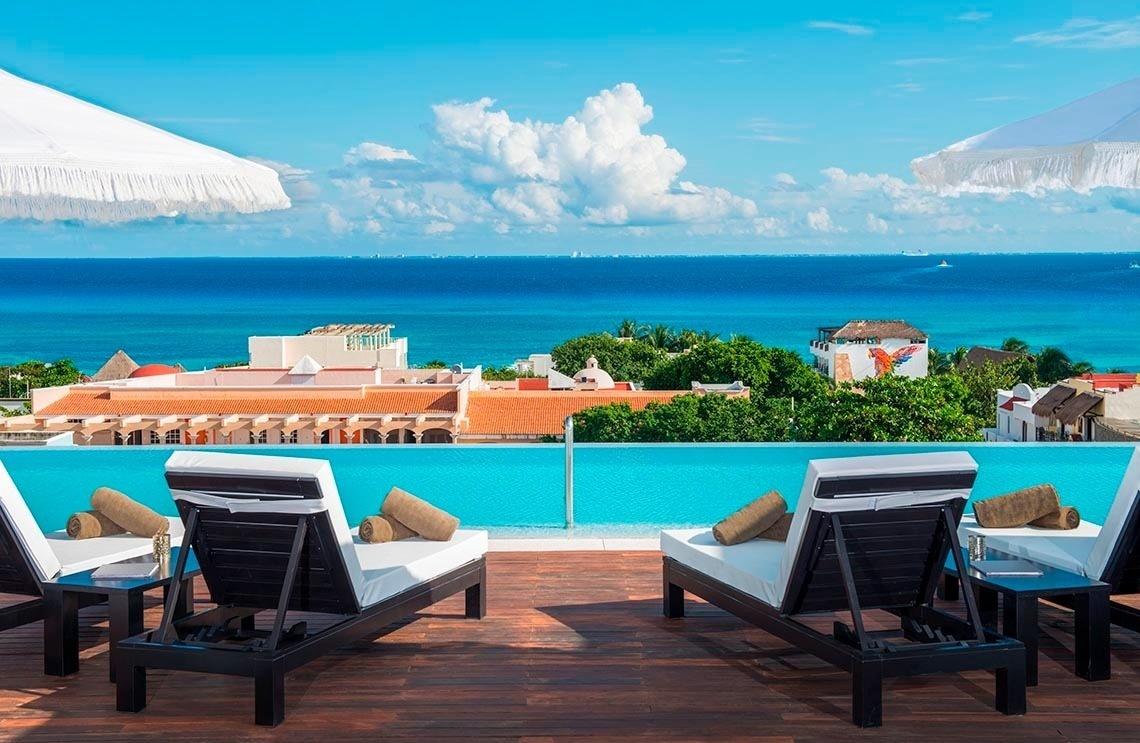 Rooftop pool with ocean views at The Fives Downtown Hotel - Curio Collection by Hilton. Official website.