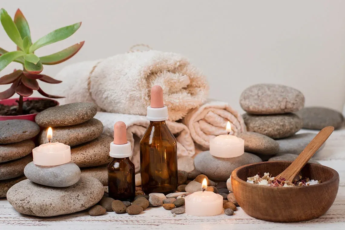 The Fives Corpo Spa: towels, candles, oils, and stones for ultimate relaxation.