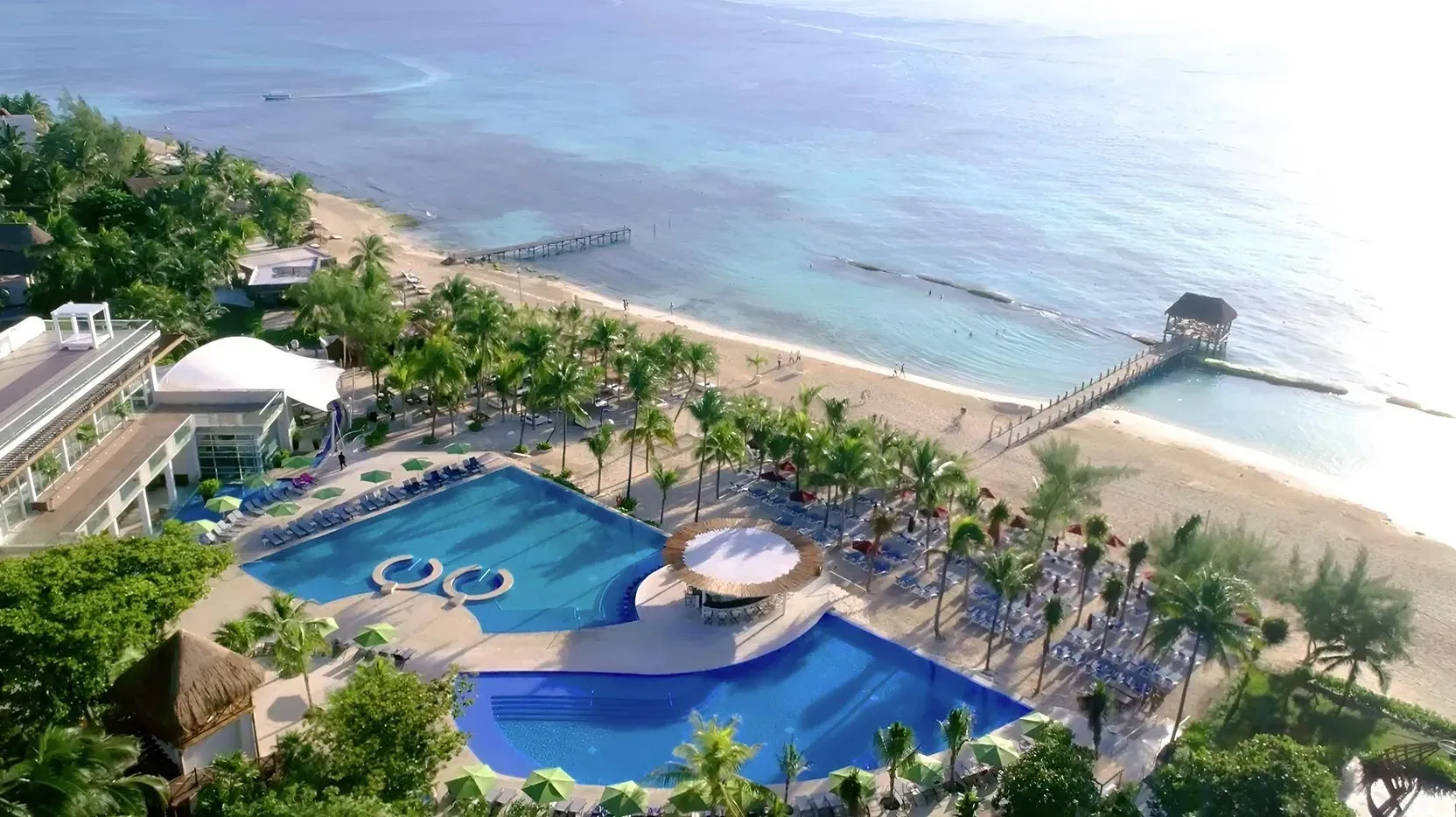The Fives Corpo: Caribbean resort with pools and beach.