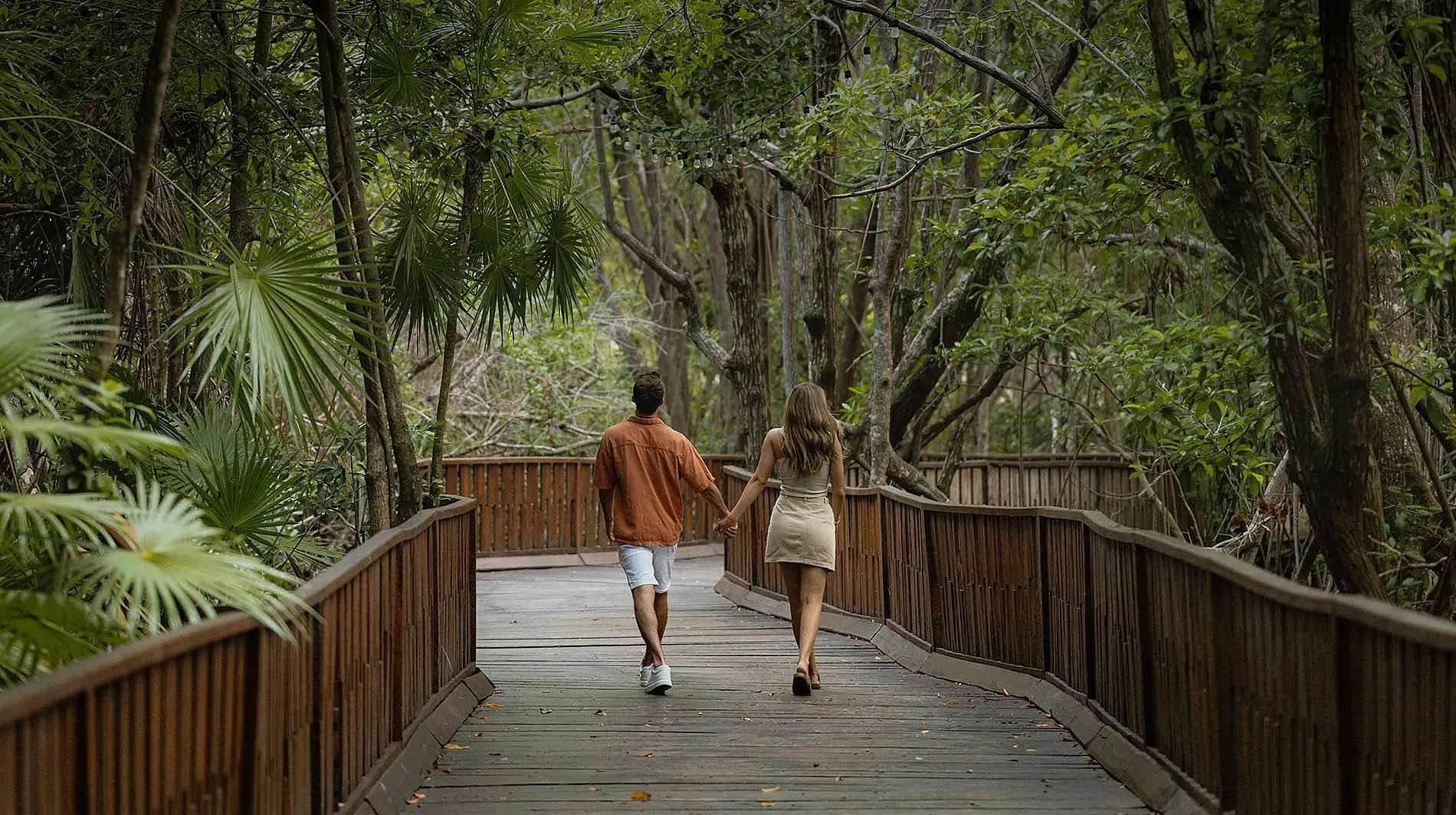 Couple on boardwalk at Gallery | The Fives Hotels & Residences | Official website