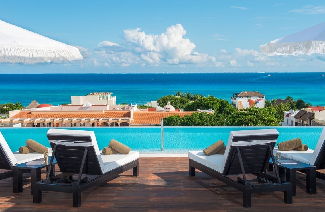 a bar with a painting of a woman on the wall