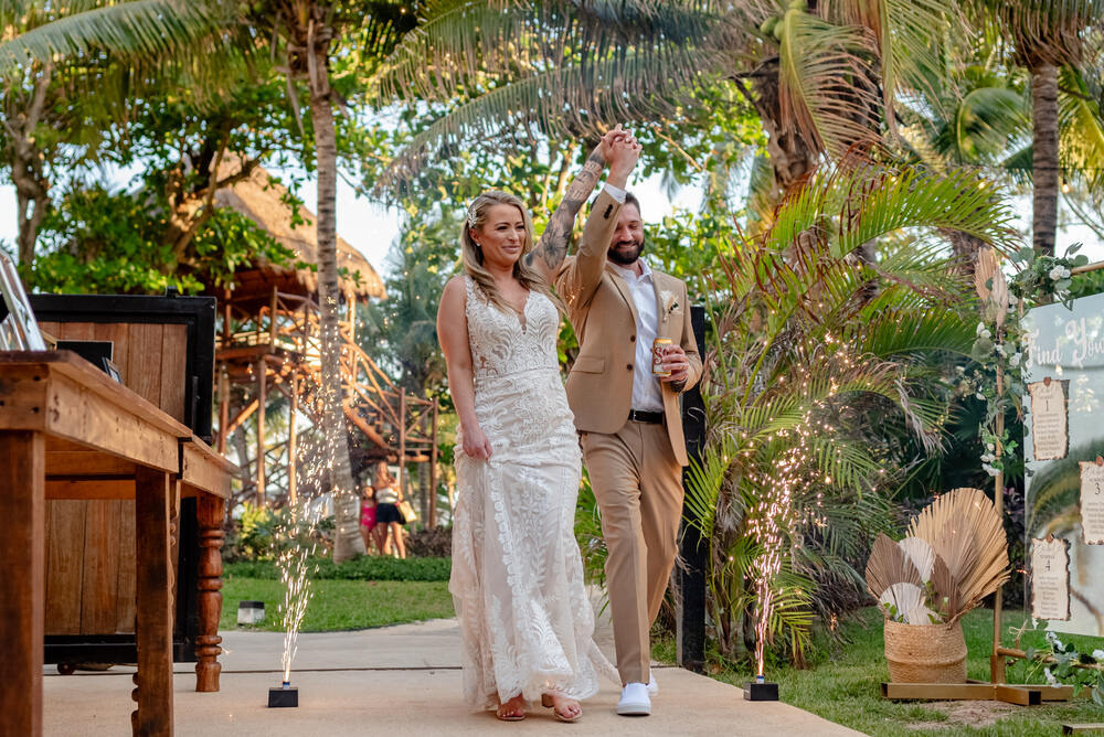 Garden wedding celebration with lights and greenery