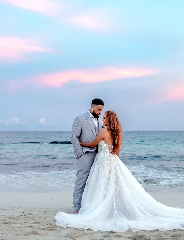 Romantic wedding photoshoot on a beach at sunset, perfect for The Fives Corpo.