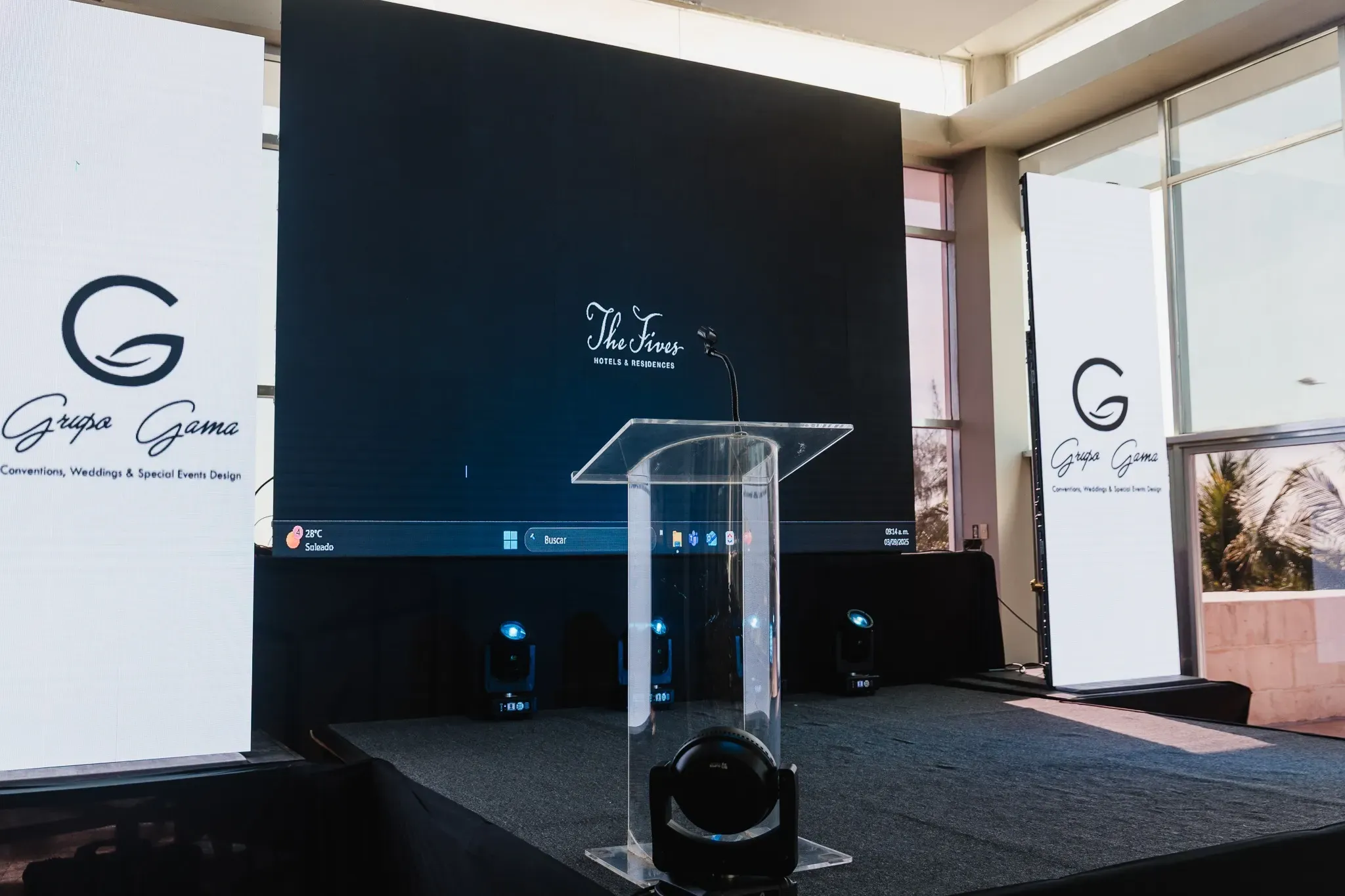 The Fives Hotels & Residences: Stage setup with The Fives Corpo branding.