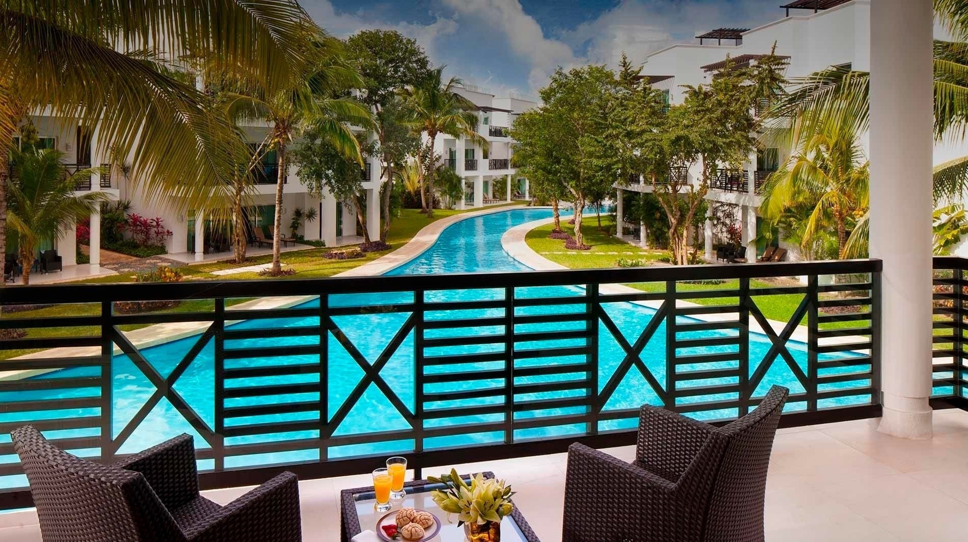 a view of a swimming pool from a balcony