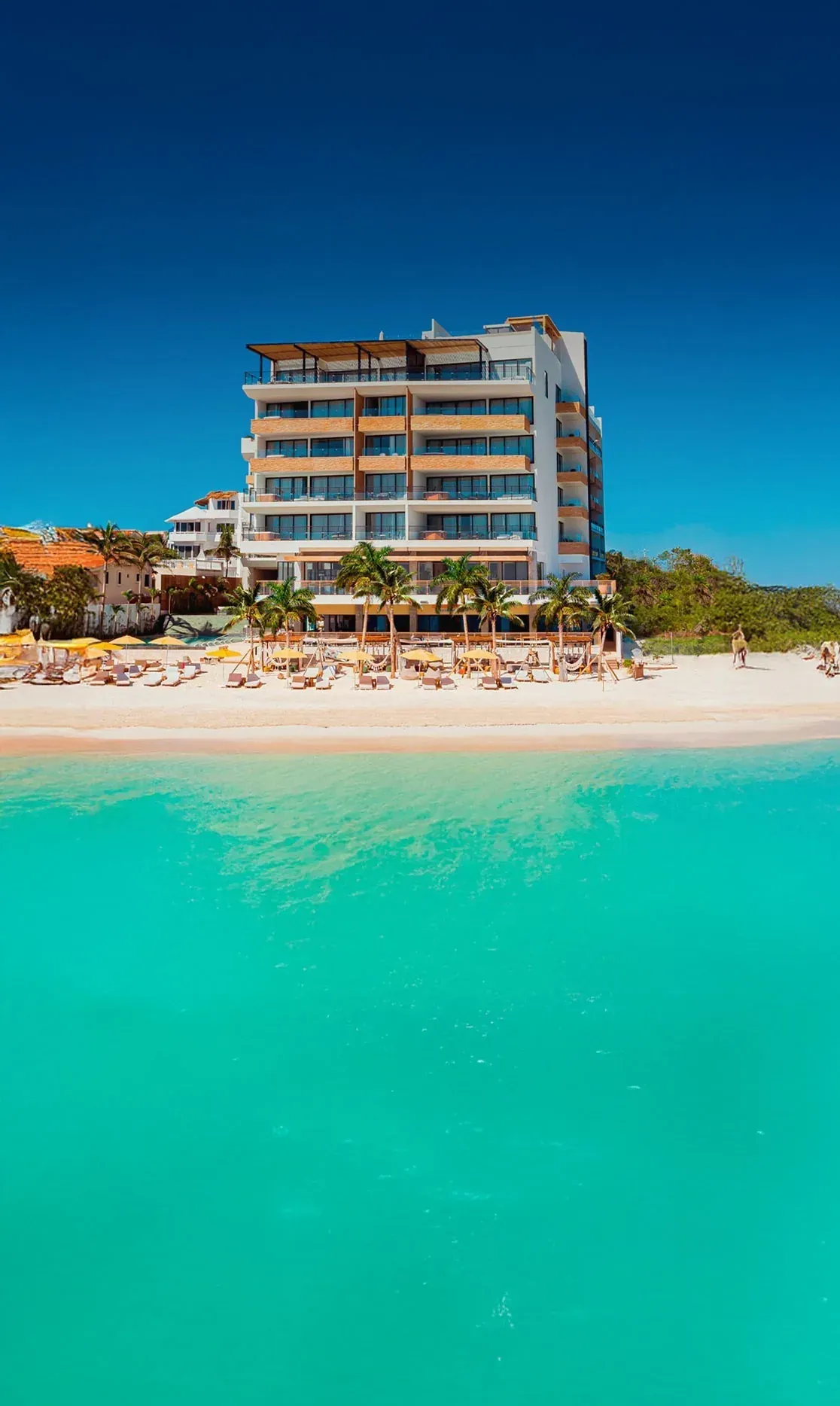 The Fives Oceanfront Riviera Maya: Beachfront hotel with turquoise waters and modern amenities.