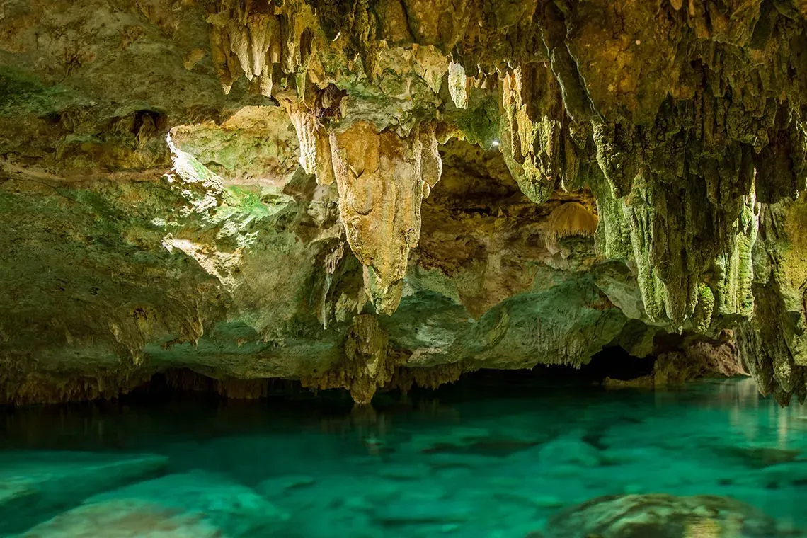Discover The Fives Corpo hotel's natural wonders: caves with turquoise water.