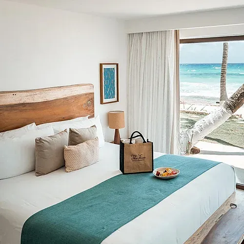 Luxury hotel room at The Fives with ocean view and welcome gift.