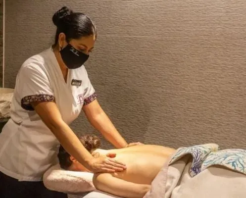The Fives Corpo therapist giving a relaxing massage to a guest.