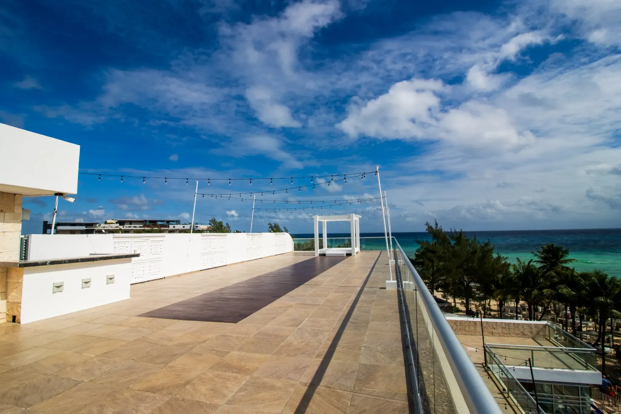 Rooftop terrace with ocean views and The Fives Corpo at this luxury hotel.
